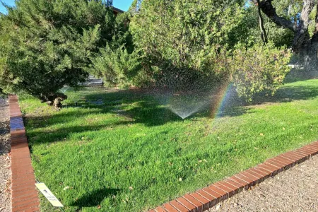 New sprinkler system installation on a lawn